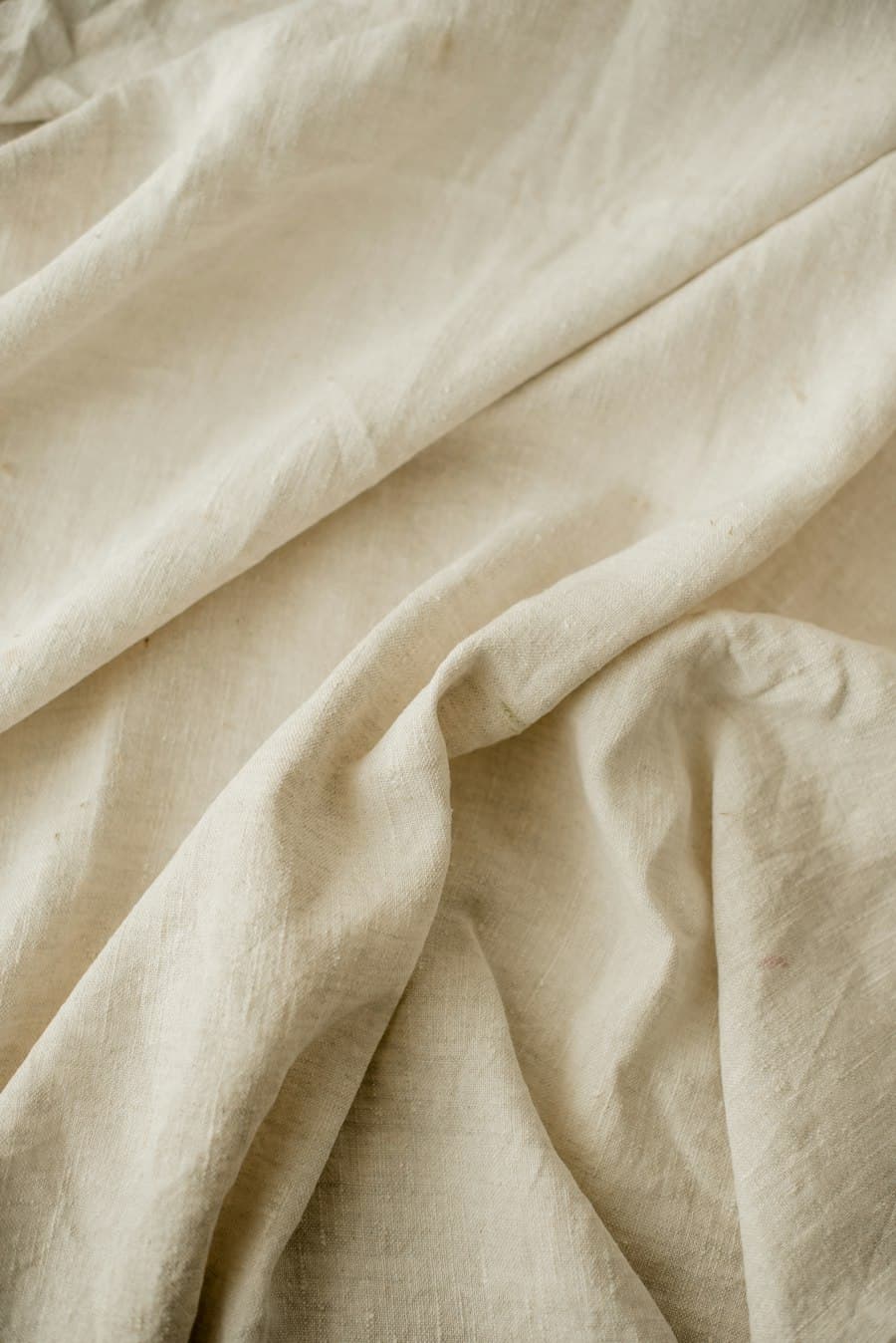 Undyed linen, loosely draped and creased
